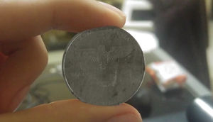 Загадка монеты со свастикой и датой 2039 год