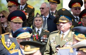 Девушка в медалях на параде Победы в Беларуси